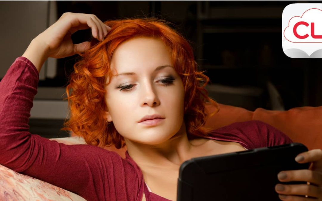 woman reading on a digital ebook reader